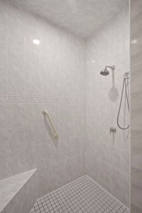 Large master bath shower with a seat