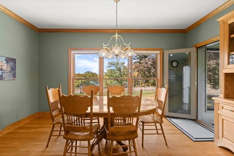 Kiitchen dining area with a view of the lake, seats 6 comfortably, extra chairs available