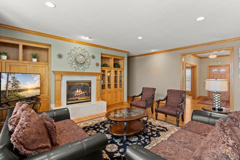 Large living area wth a 65" smart Roku tv and a gas fire place.