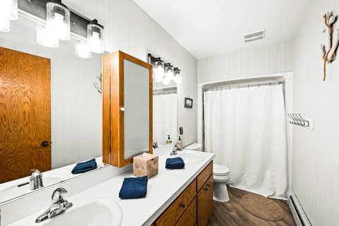Main floor full bath, shower/tub combo and double sink