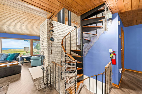Staircase to the loft bedroom and 1/2 bathroom