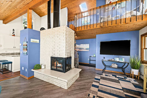 Relax by the coxy fireplace featuring a clean burning fireplace with wax logs- instant warmth, and ambiance with not mess