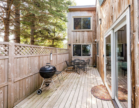 Large private deck with outdoor table, seats 4, extra chairs, lake view and a charcoal grill