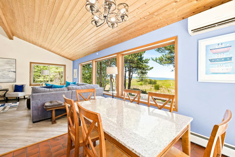 The kitchen table seats 8 with a lake view