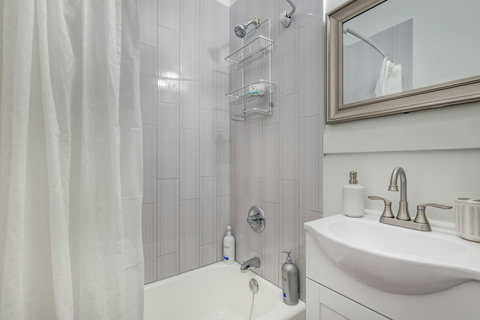 Shower with shampoo, conditioner, body soap, and storage for your toiletries. Sink with hand soap and storage for your toothbrushes.