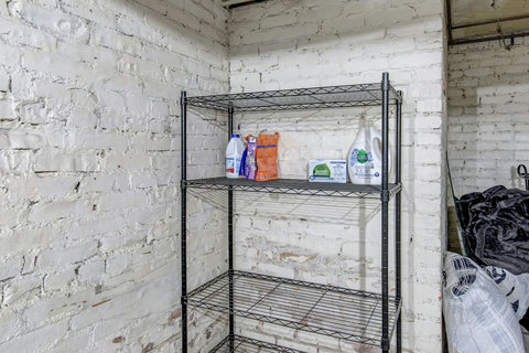 Laundry detergent and dryer sheets provided. Lots of storage for other items.