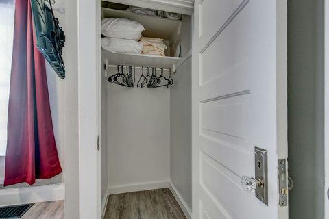 Bedroom closet with hangers for your clothing and storage for your suitcases. Extra sheets for the bed, and pillows and a blanket for the sleeper sofa in the living room.