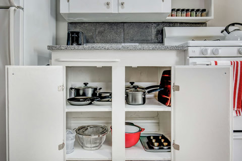 Pots and pans, cutting boards, strainers, baking sheet, muffin tin, mixing bowls