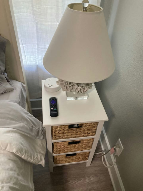 Nightstand with a charging station and remote for the TV