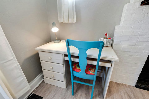 Your workstation with drawers, space for a laptop/monitor and keyboard, and desk supplies.