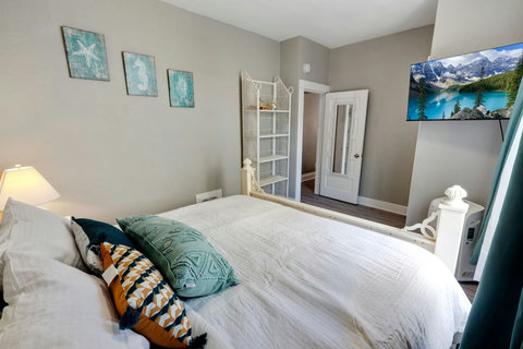 HD TV and shelving for storage in the bedroom