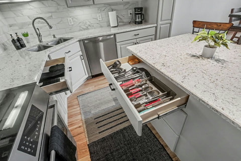 Kitchen stocked with cookware and utensils