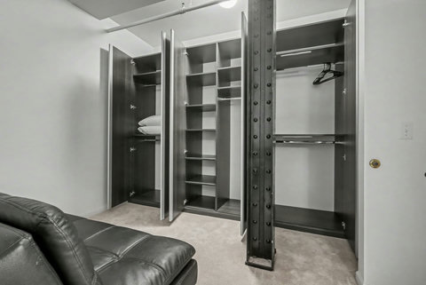 Custom-built closet in the upstairs bedroom along with an additional sleeping area with futon
