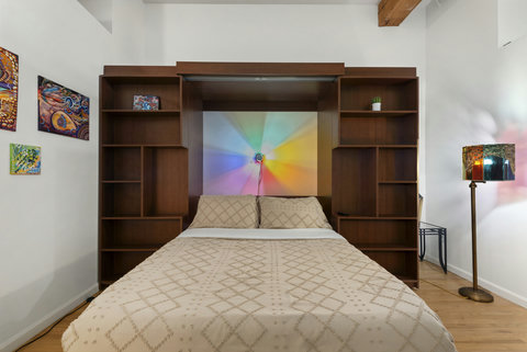 Secondary bedroom downstairs with queen-sized Murphy bed