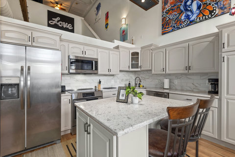 Art featured in the open-concept kitchen