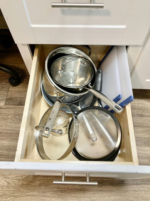 Frying pans, pots, mixing bowl, strainer, cutting boards