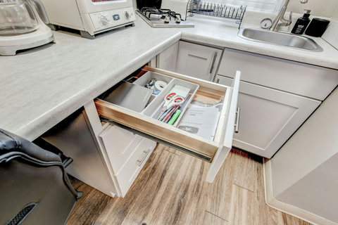 Your basic office supplies: scissors, tape, stapler, pencils, pens, notepads, post-it notes, and manuals if there are questions about operation of any kitchen equipment.