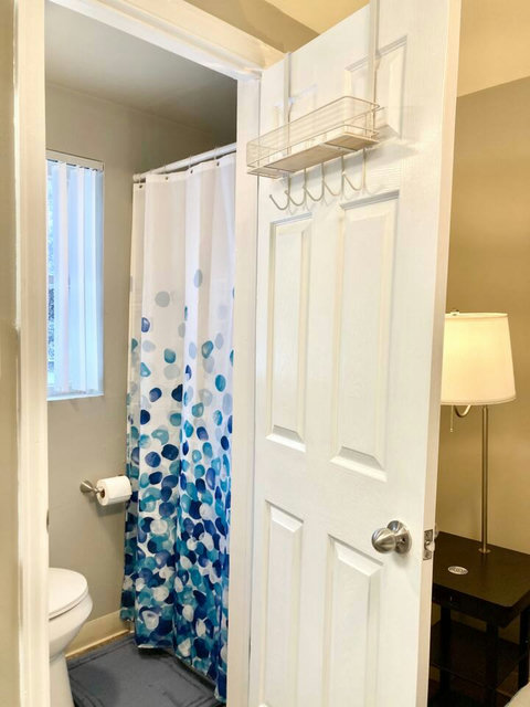 Plenty of hooks and a shelf for your toiletries on the bathroom door