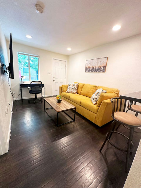 Full living room and workspace area