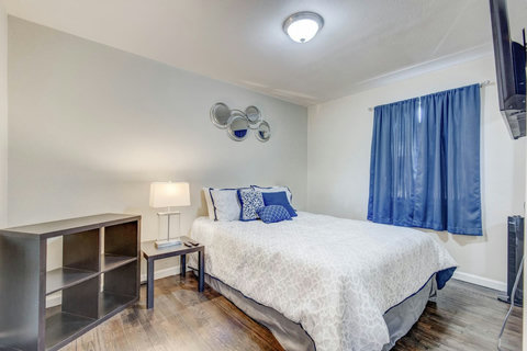 Bedroom with comfy queen-sized bed and new comforter and sheets