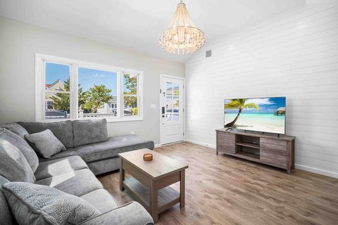 Living room with pullout sectional couch and shiplap accent wall. 
