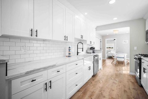 Marble-look quartz counters and all black hardware. 