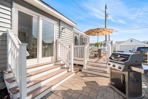 Side patio with access from the dining room. Start up the Weber Grill!