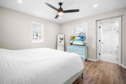 Master bedroom with view into private en-suite bath. 