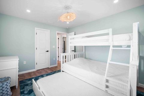 Bunk room with two twins and one full. 
