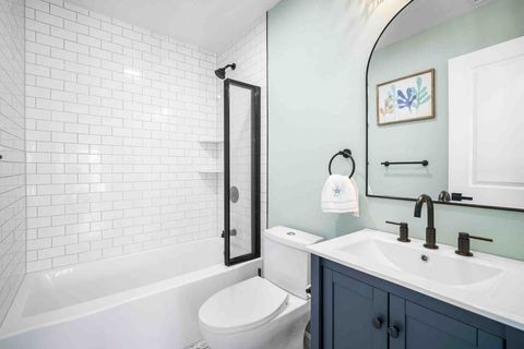 Accordion style folding glass shower door for easy bath time!