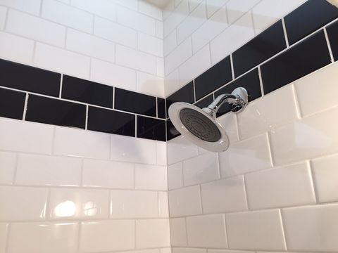 Beautifully tiled with white and black Subway tiles