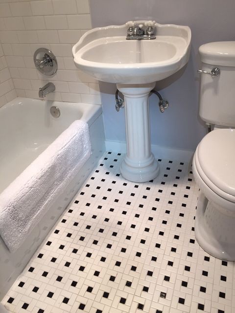 All brand new bathroom, but made to look like the 1920's