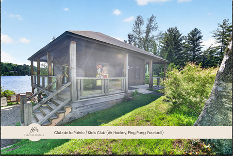 Lakeside clubhouse with covered porch and fun family game amenities