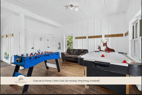 Bright family game room with air hockey, foosball, and cozy seating
