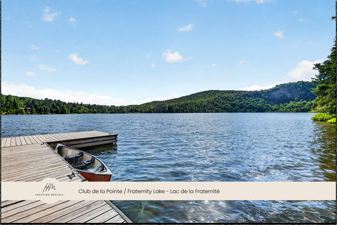 Private dock with boat access on a serene lake with scenic mountain views