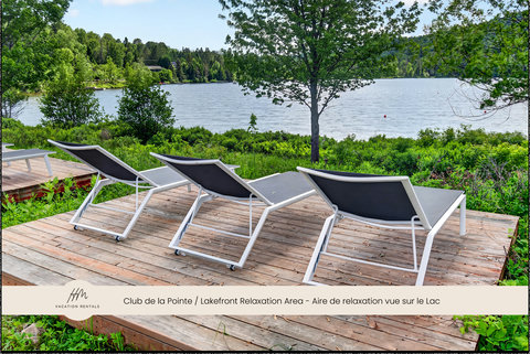 Lakefront lounging deck with serene water views and peaceful greenery
