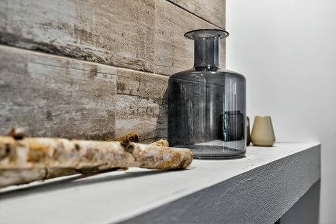 Rustic wood accent wall with elegant decor details