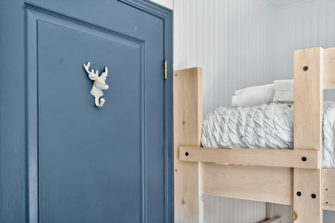Cozy bunk nook with plush bedding and charming rustic details