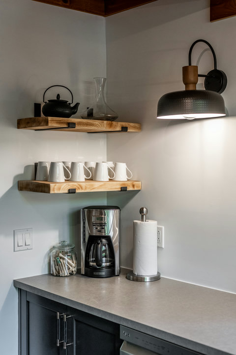 Stylish coffee nook with floating shelves and modern rustic touches