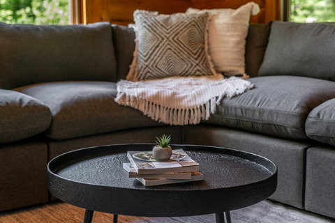 Cozy modern lounge with plush sectional and stylish coffee table