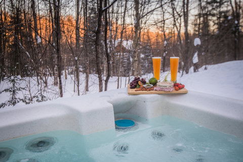 Soak in the snowy hot tub with sunset views and après-ski treats
