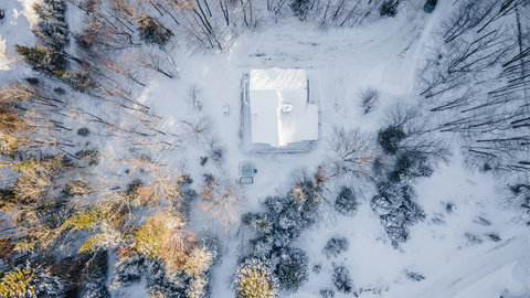 Secluded snowy cabin retreat surrounded by peaceful forest views