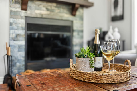 Cozy lounge with stone fireplace—rustic charm and toast-ready style