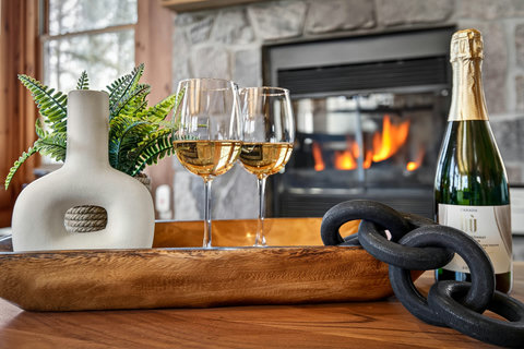 Cozy fireside setting with bubbly—perfect for a romantic night in.