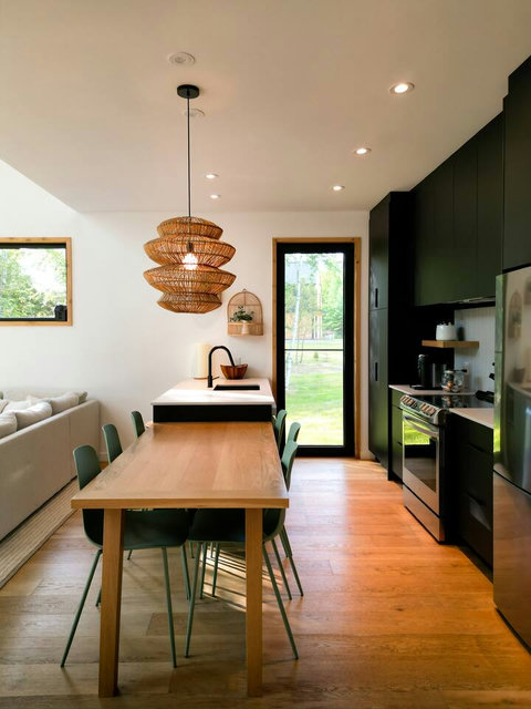 Natural light, modern seating, and a cozy vibe for every meal of the day. Taken 05/2025.