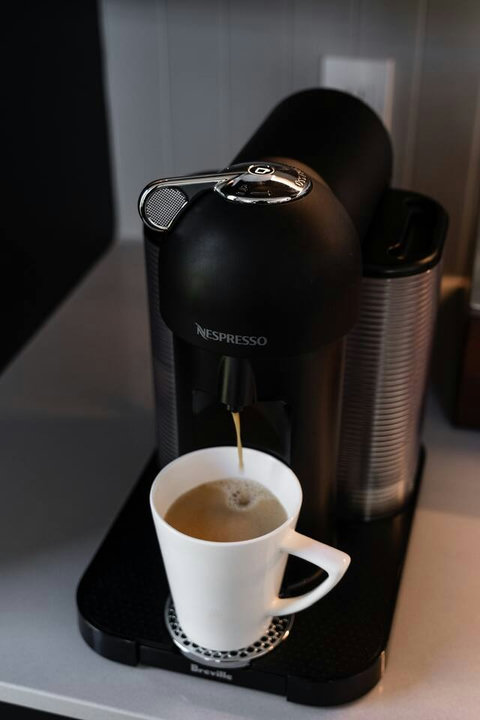 Enjoy a Nespresso Vertuo machine with a starter supply of capsules, plus a drip coffee maker with ground coffee provided.