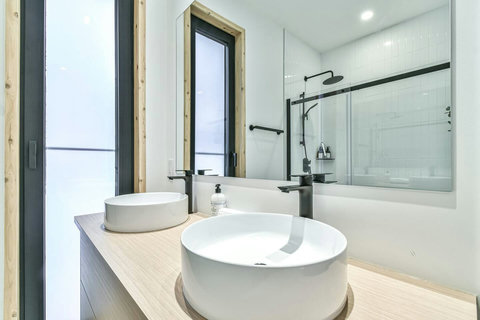 The primary ensuite blends luxury and function with double vanities and a spa-like design.