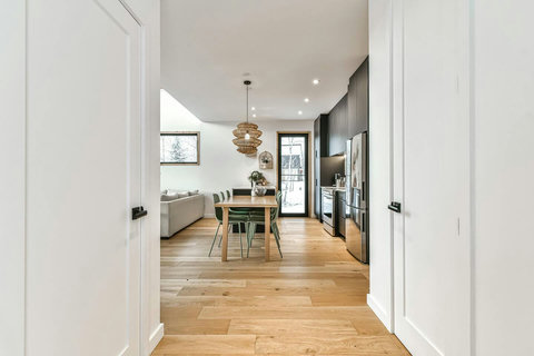 The entry hallway leads into the open living space, with the half bath tucked to the right and laundry conveniently located to the left.