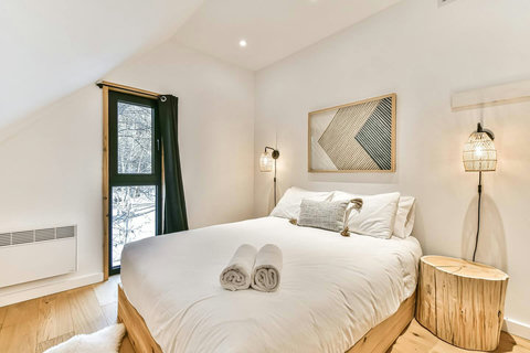 Bedroom 3 - A clutter-free design with queen bed, storage, and blackout blinds for undisturbed rest.