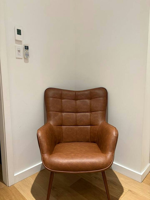 Extra seating adds both comfort and charm to the bedroom.